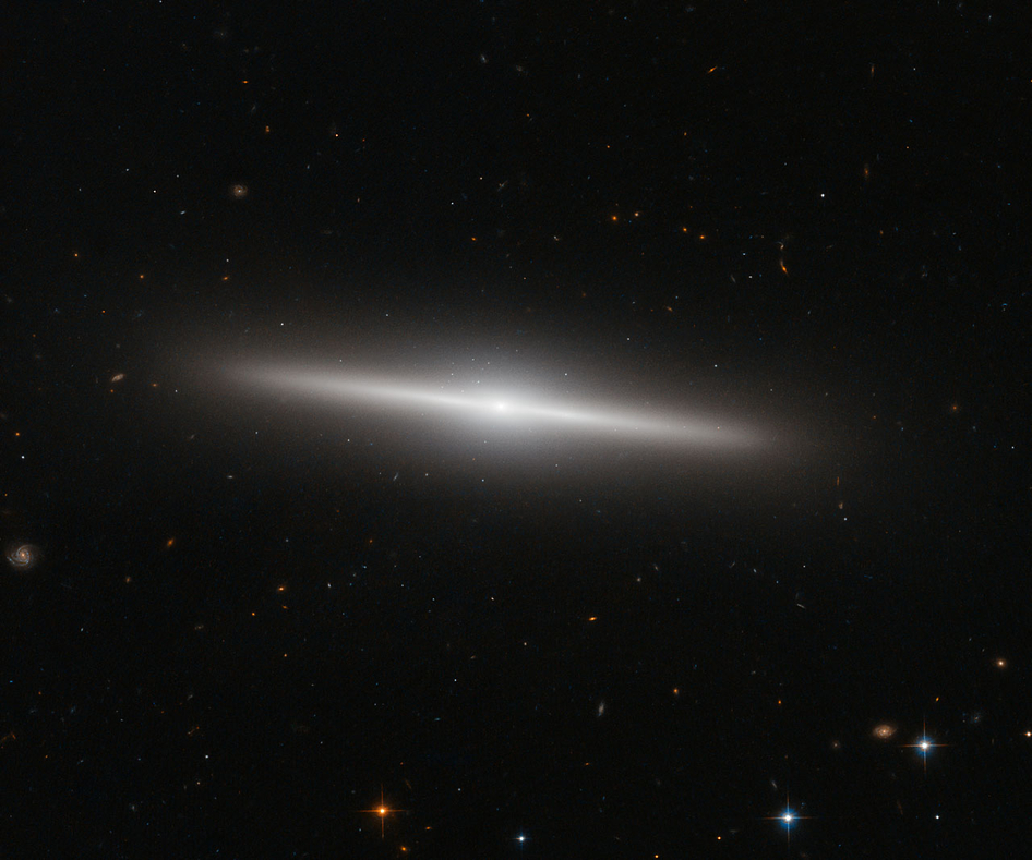 Hubble Sees a Galaxy With a Backdrop of Distant Galaxies