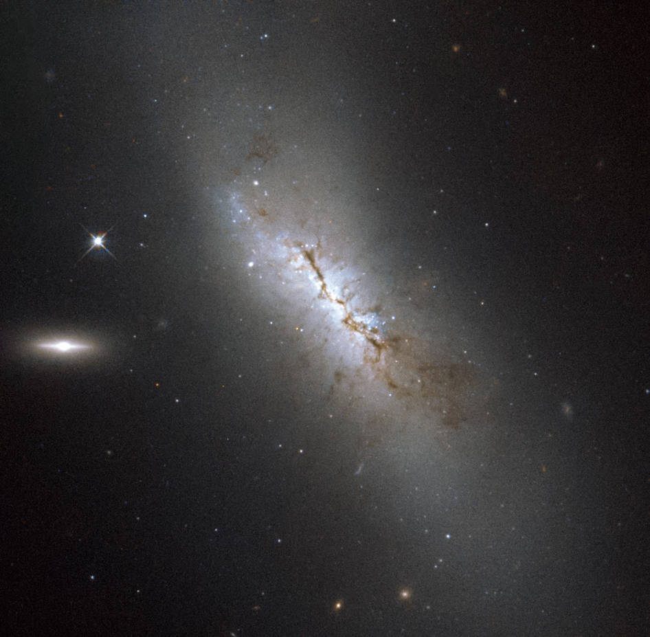 Hubble Images a Dusty Galaxy, Home to an Exploding Star